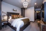 Master bedroom with King bed and TV
